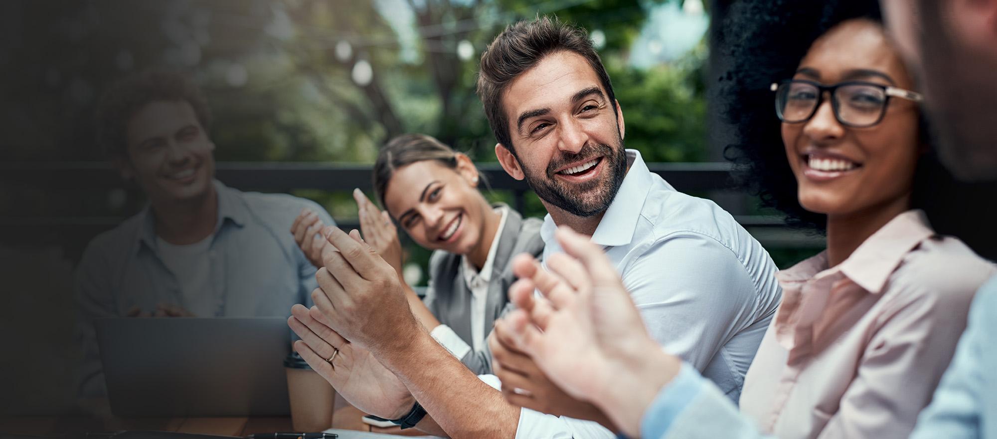 CentralSquare employees smiling during a meeting