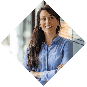 A professional woman smiling in an office setting.