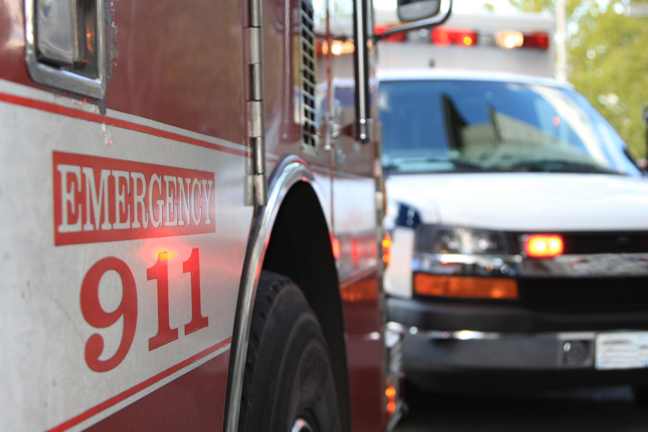 An image showing an ambulance and fire truck with "Emergency 911" written across the side.