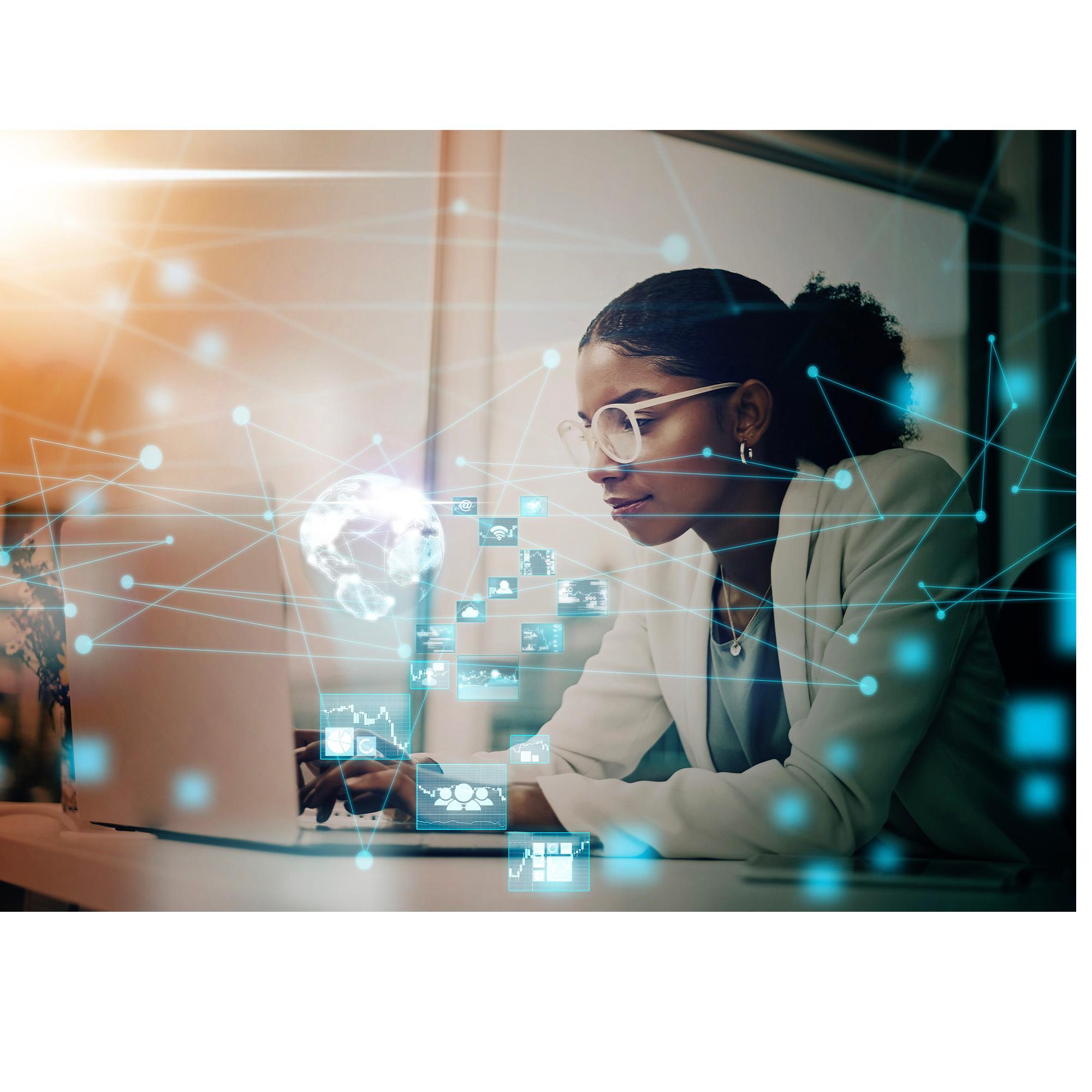 Woman working at a computer screen with networks and icons on top