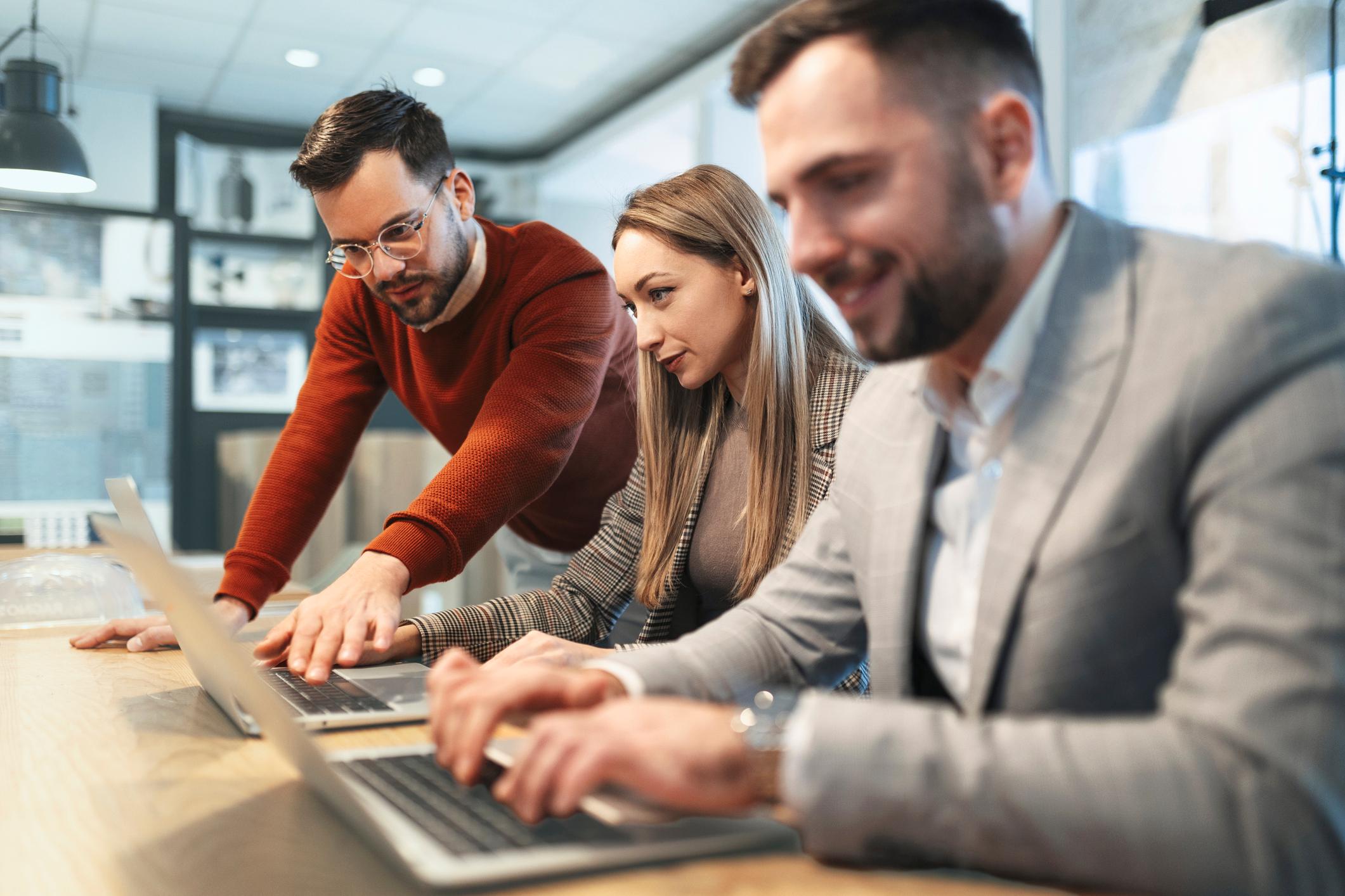 three professionals working together